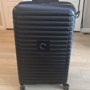 Black Delsey Paris Hardshell Rolling Suitcase